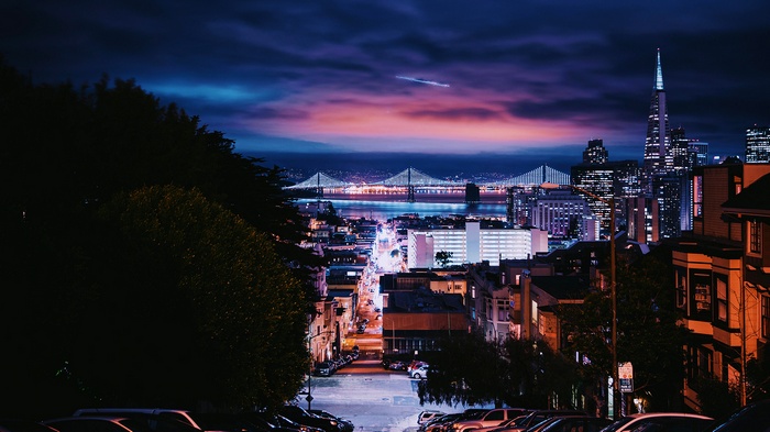 San Francisco cityscape at night with bridges and skyscrapers