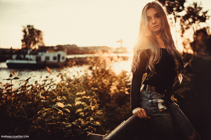 Woman with blonde hair outdoors at sunset
