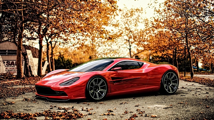 Red Aston Martin DBC concept car on a street with autumn leaves