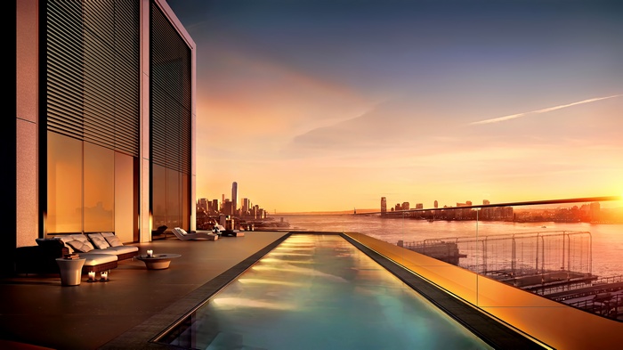 Rooftop infinity pool overlooking New York City at sunset