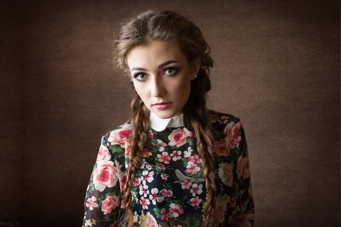 Woman with pigtails and green eyes