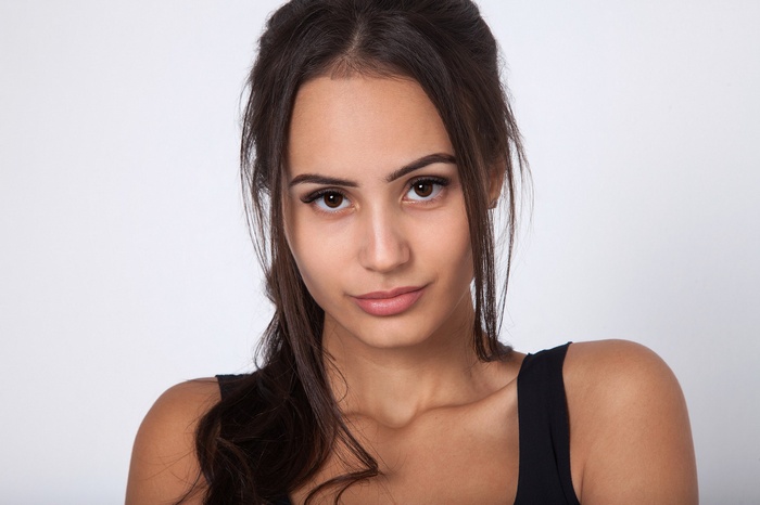 Portrait of a young tanned woman