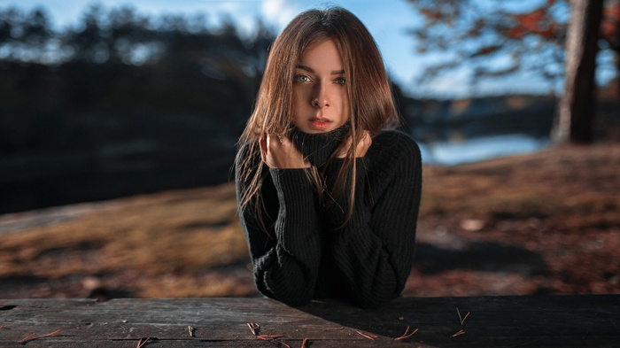 Woman in black turtleneck outdoors