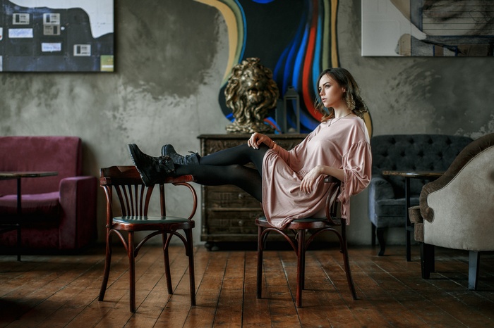 Woman sitting on a chair in a room
