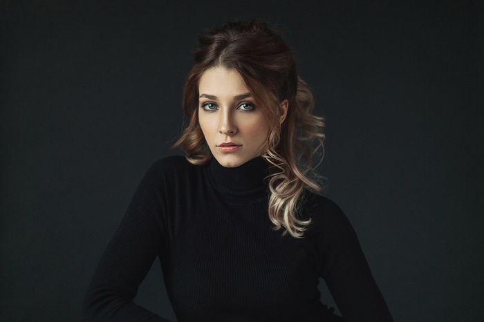 Woman in black turtleneck by Maxim Makarov