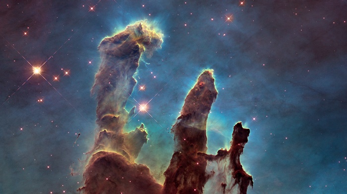 Pillars of Creation nebula in space with stars