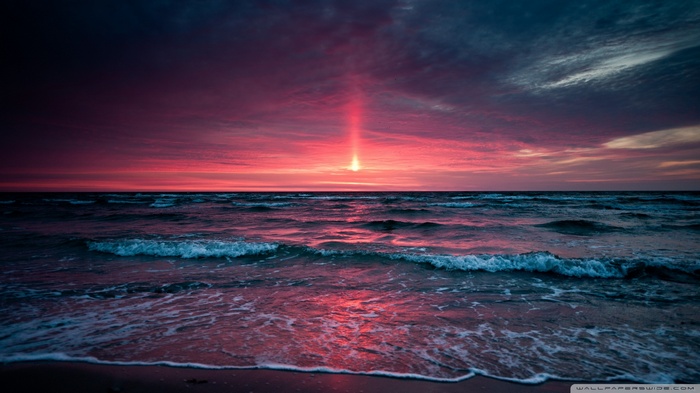 Sunset over the sea with dramatic sky