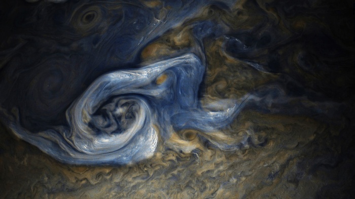 Jupiter's turbulent atmosphere with swirling clouds