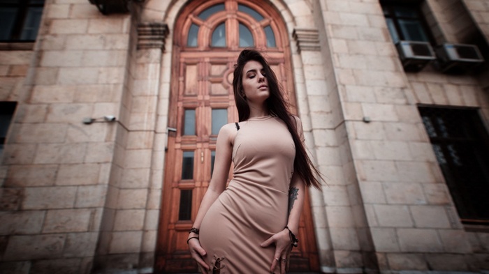 Woman with long hair in a dress outdoors