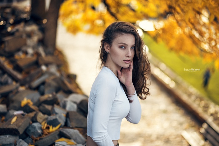 Woman with blue eyes in a white shirt