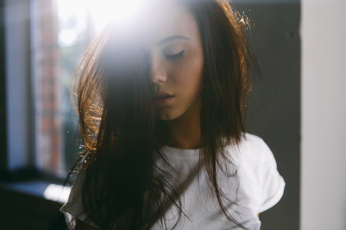 Woman with closed eyes and eyeliner
