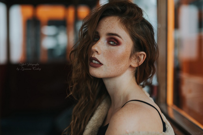 Portrait of a woman with freckles and makeup