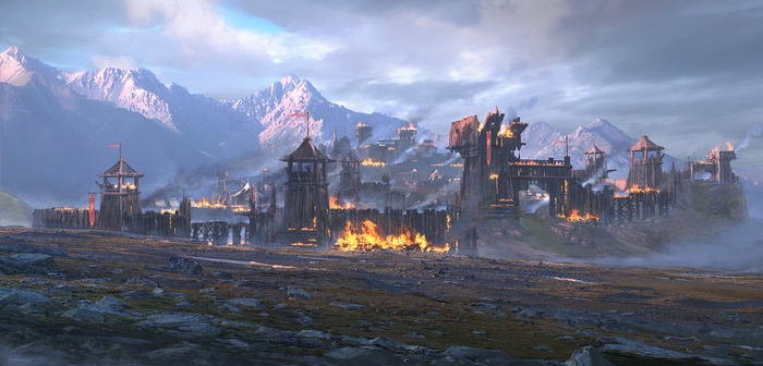 Burning wooden fortress in a mountain valley