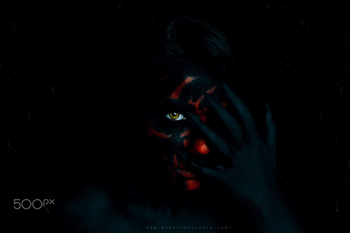 Woman with black and red face paint