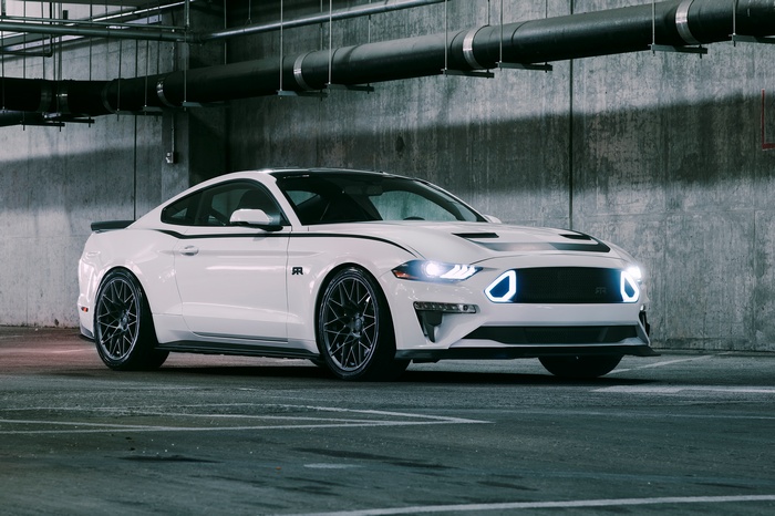 White Ford Mustang with racing stripes