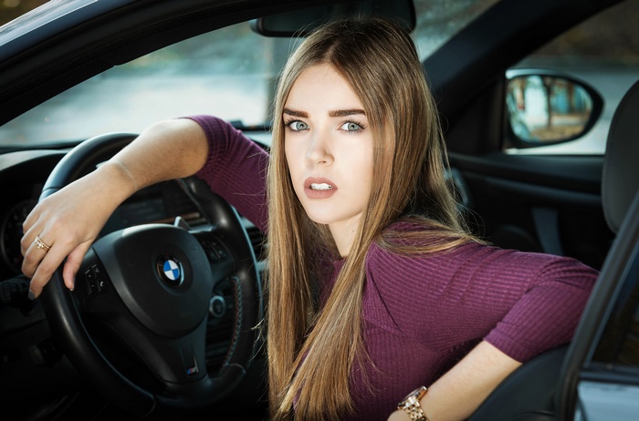 Woman in BMW E90 interior