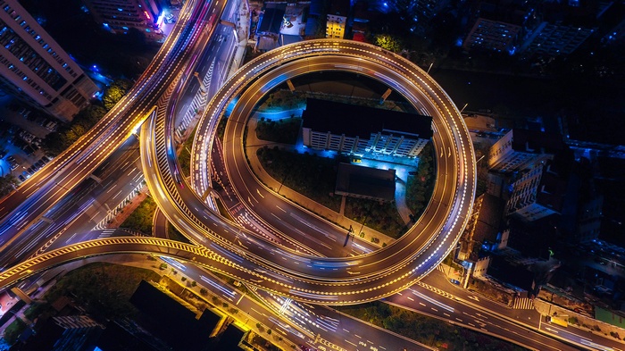 Aerial view of a busy highway interchange at night