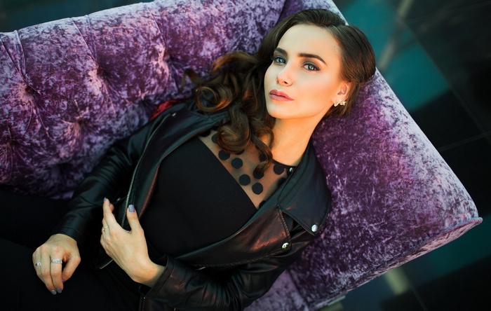 Woman with long hair wearing a leather jacket