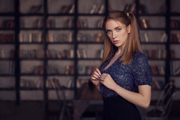 Woman with pigtails in a library