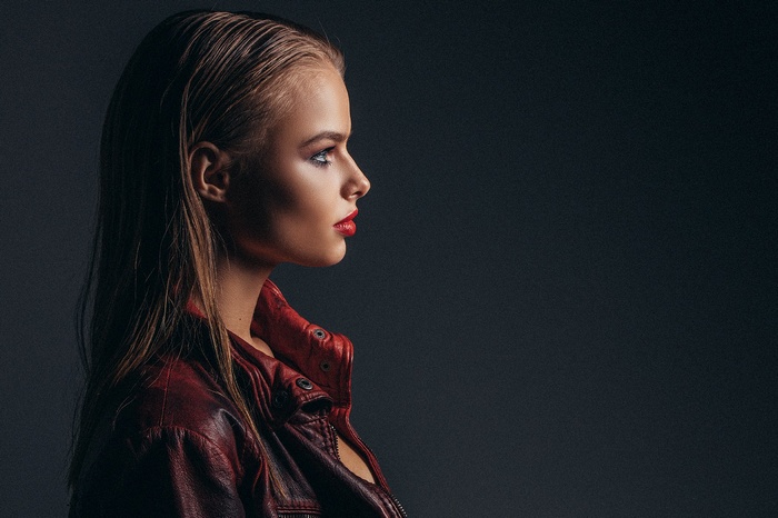 Woman in red leather jacket, profile portrait