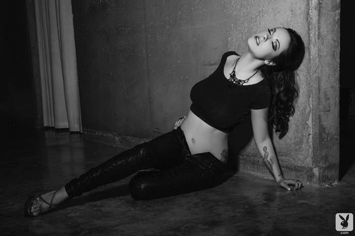 brunette, closed eyes, Elizabeth Marxs, women, T-shirt, Playboy, black clothing, tattoo, wall, long hair, monochrome, sitting, high heels, model, belly, on the floor, unbuttoned
