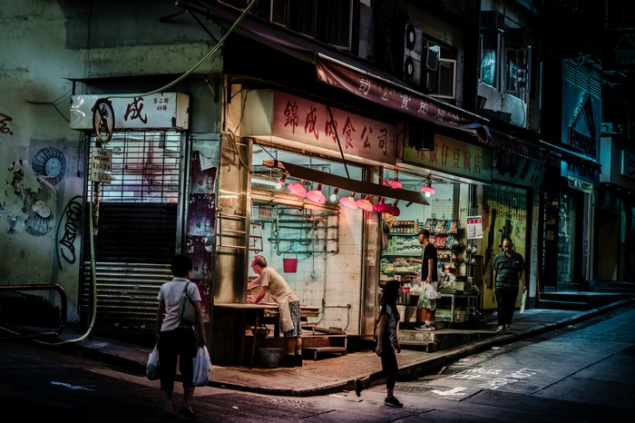 Street scene in Hong Kong at night with shops