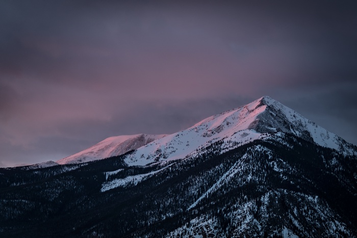 Snow-covered mountains at dusk