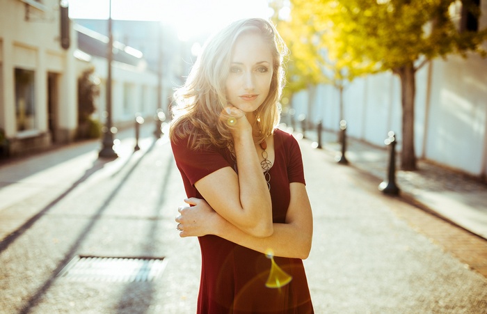 Woman with blonde hair in a street