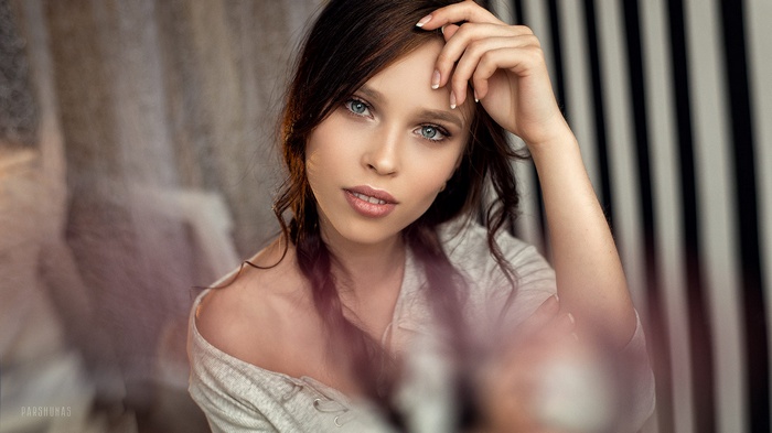 Portrait of a young woman with blue eyes by Anton Parshunas
