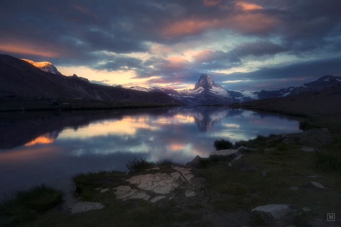 Matterhorn mountain reflected in a lake at sunset