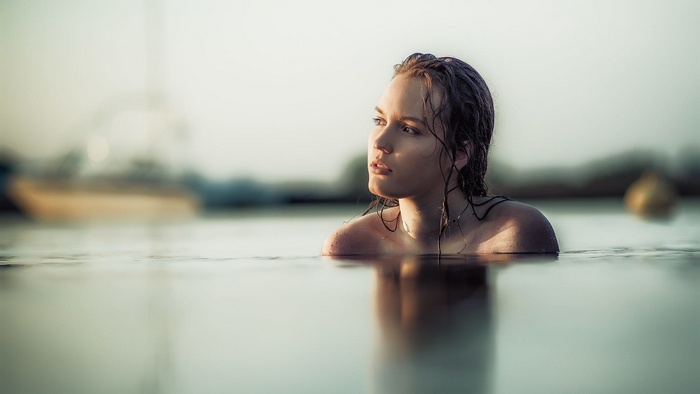 Woman with wet hair in water