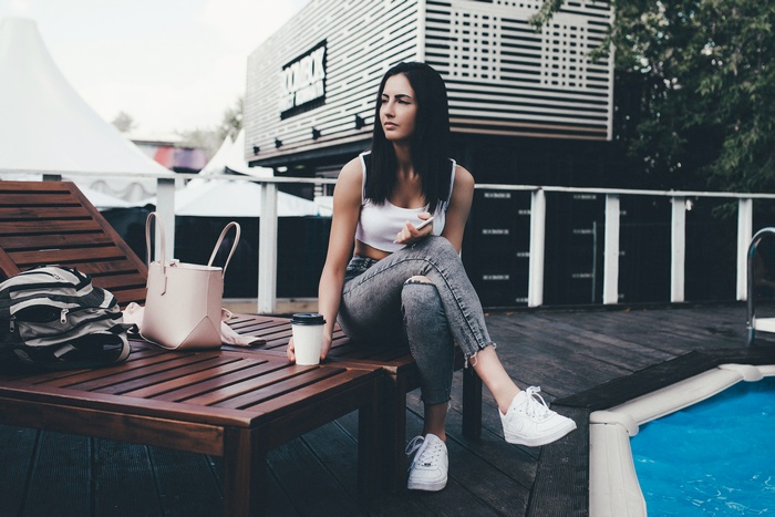 eyeliner, portrait, swimming pool, looking away, jeans, sitting, sneakers, women, women outdoors