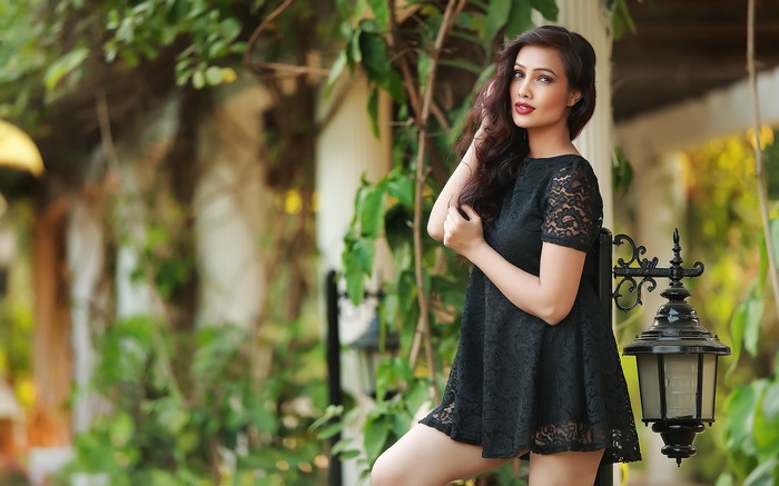 Swathi Muppala in a black lace dress outdoors