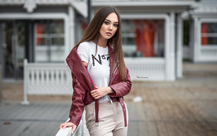 Woman in leather jacket and white t-shirt