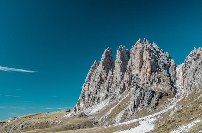 Jagged mountain peaks under a clear blue sky
