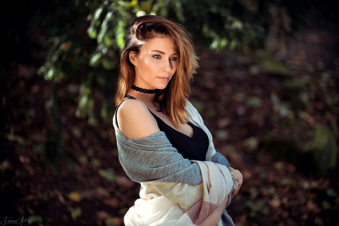 Woman with choker and scarf outdoors