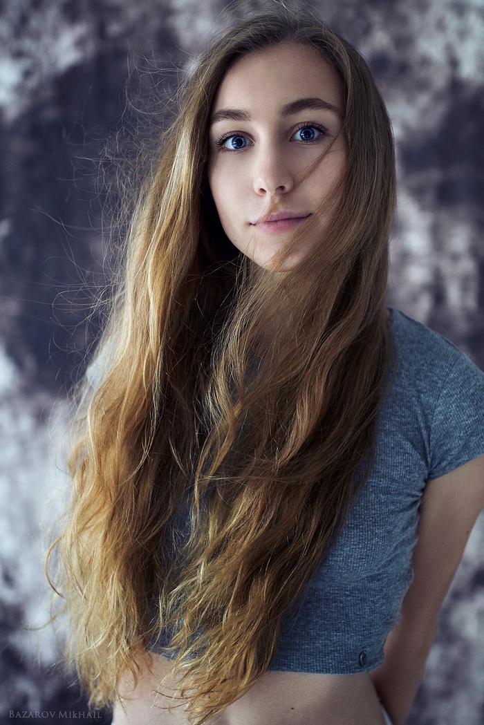 Woman with long blonde hair by Mikhail Bazarov
