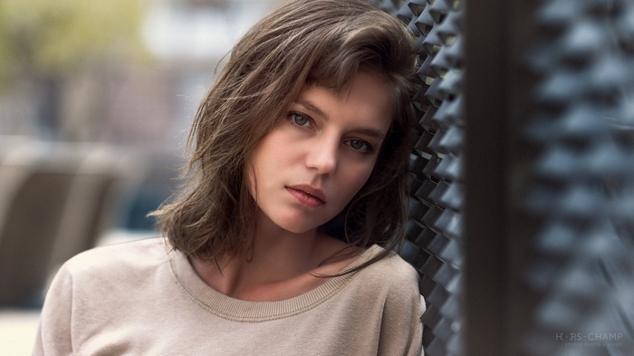 Portrait of a woman with blue eyes outdoors
