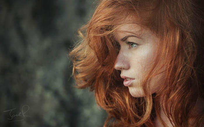 Woman with red hair in profile