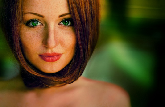 Redhead woman with green eyes and freckles