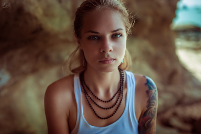 Portrait of a blonde woman with a tattoo