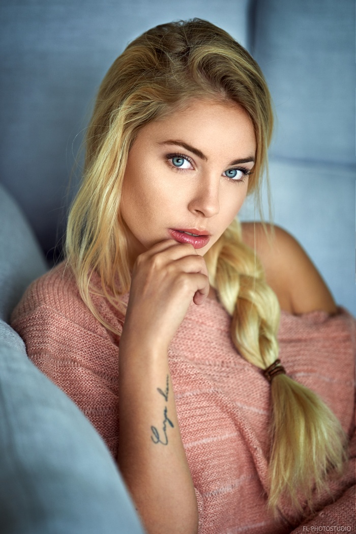 Cassandre Lamarche with blonde braids and blue eyes