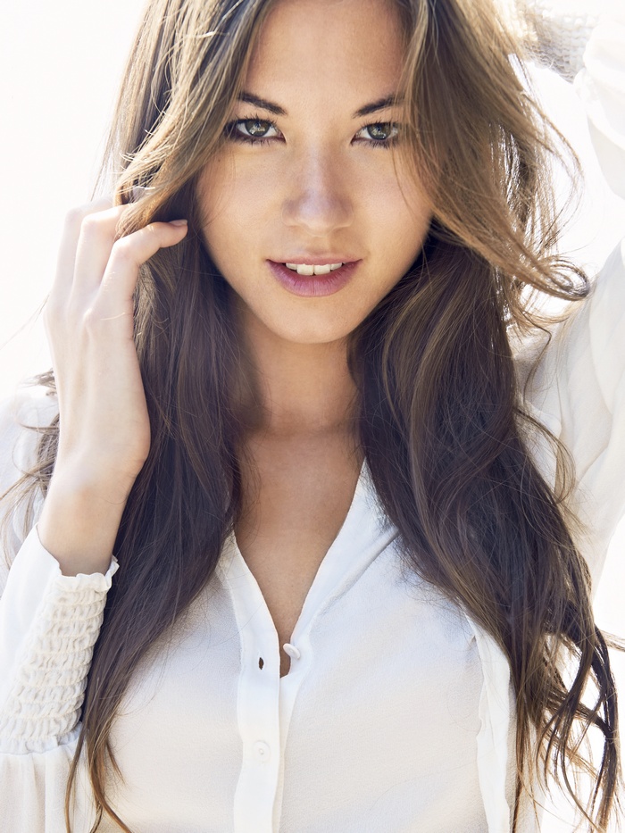 Megan Nakata portrait with long brown hair