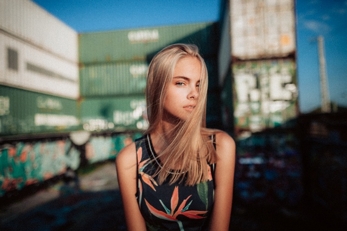 Woman with blonde hair in a floral top