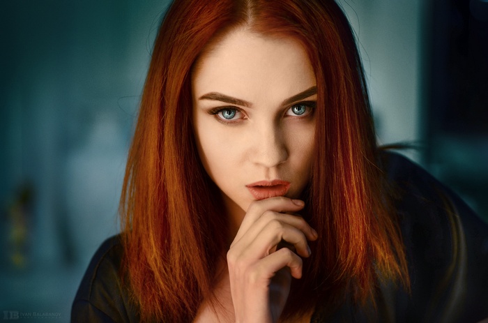 Portrait of a redhead woman with blue eyes