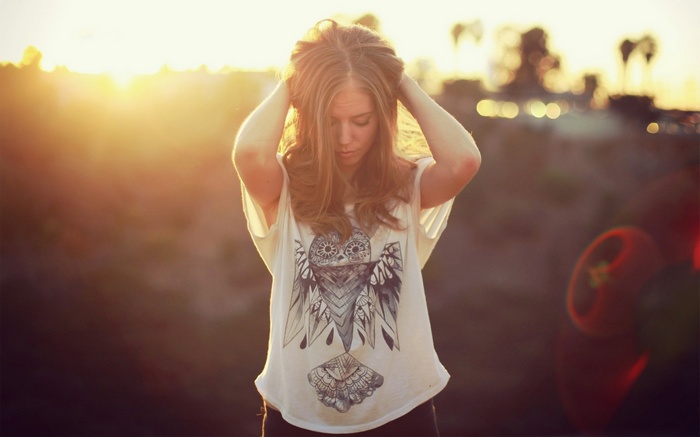 Woman with owl t-shirt in sunlight