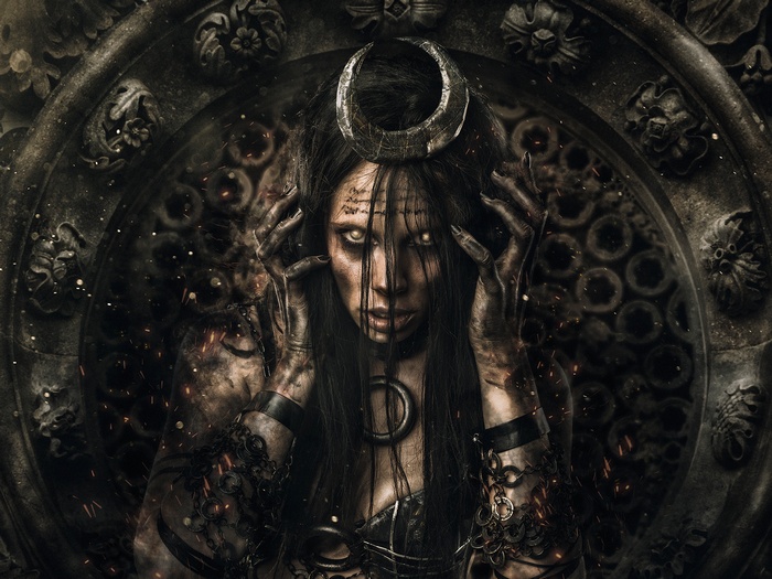 Dark fantasy portrait of a woman with a crescent moon headdress