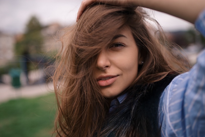 Woman with hair blowing in the wind