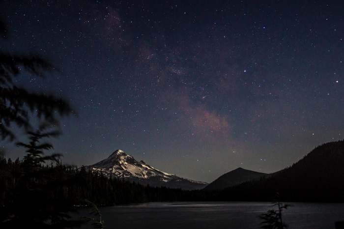 Starry night over a mountain lake