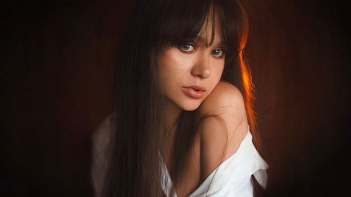 Portrait of Maria Kozhevina with freckles and bangs